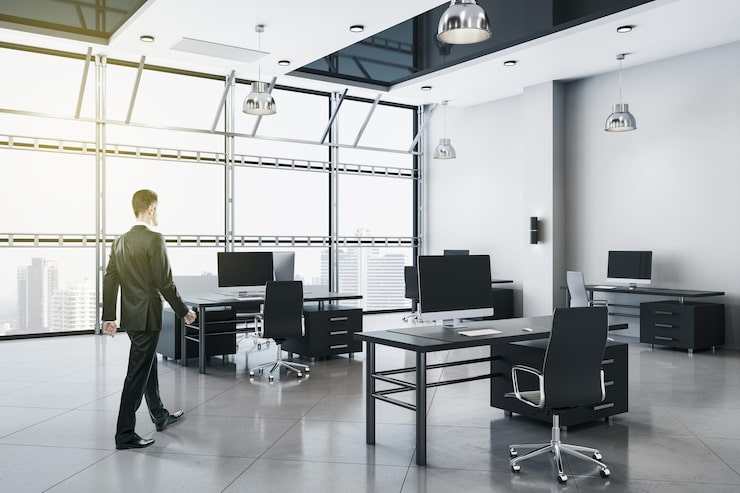businessman-walking-modern-office-interior_670147-18523