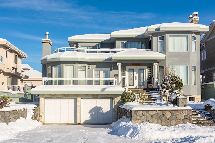 luxury-residential-house-with-double-garage-winter-sunny-day_769578-2170